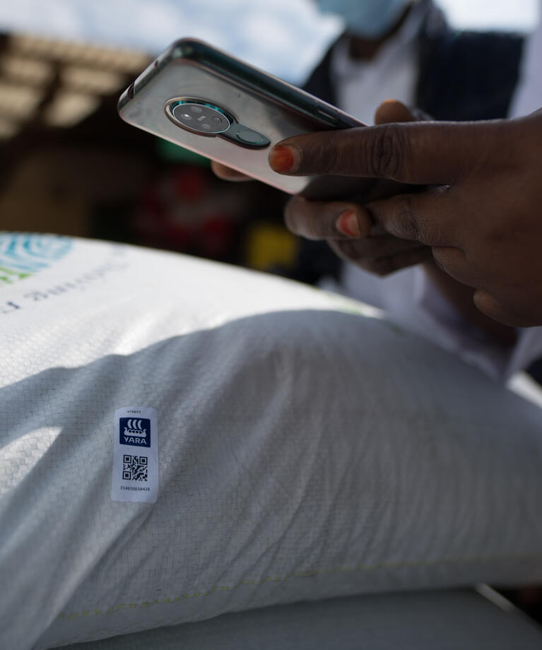 Woman scanning QR code with a mobile phone