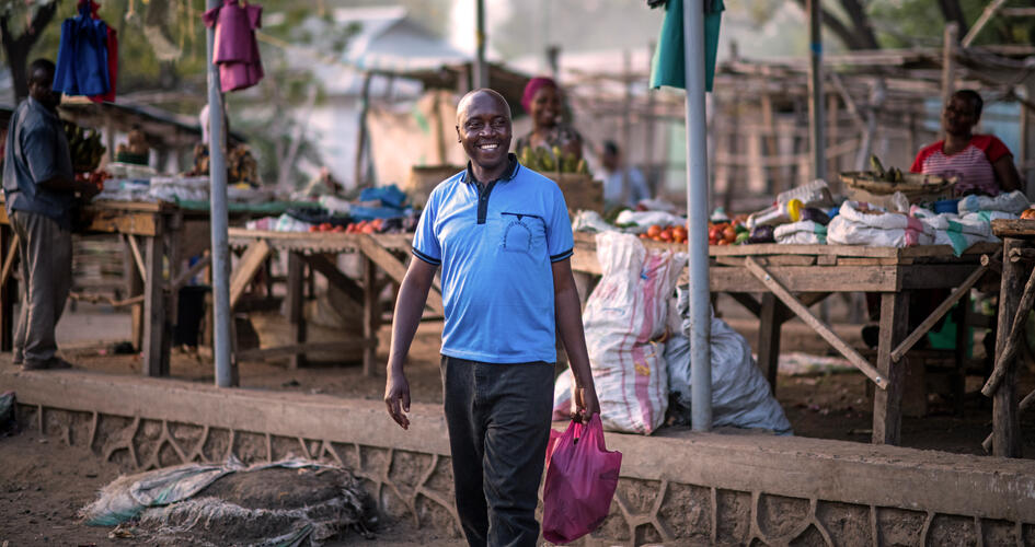 Jonathan Hudson Mujema in a market