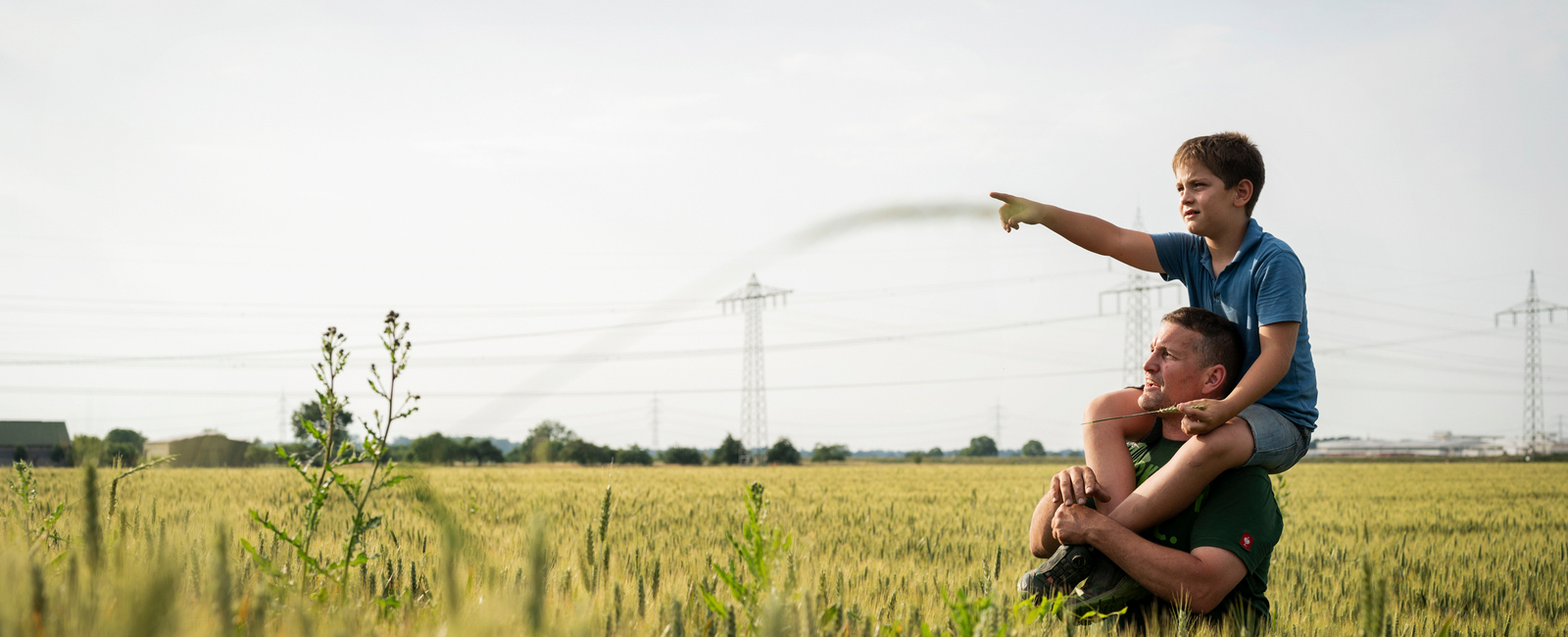 Father and son in a field
