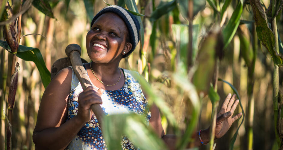Female African farmer smiling and looking up