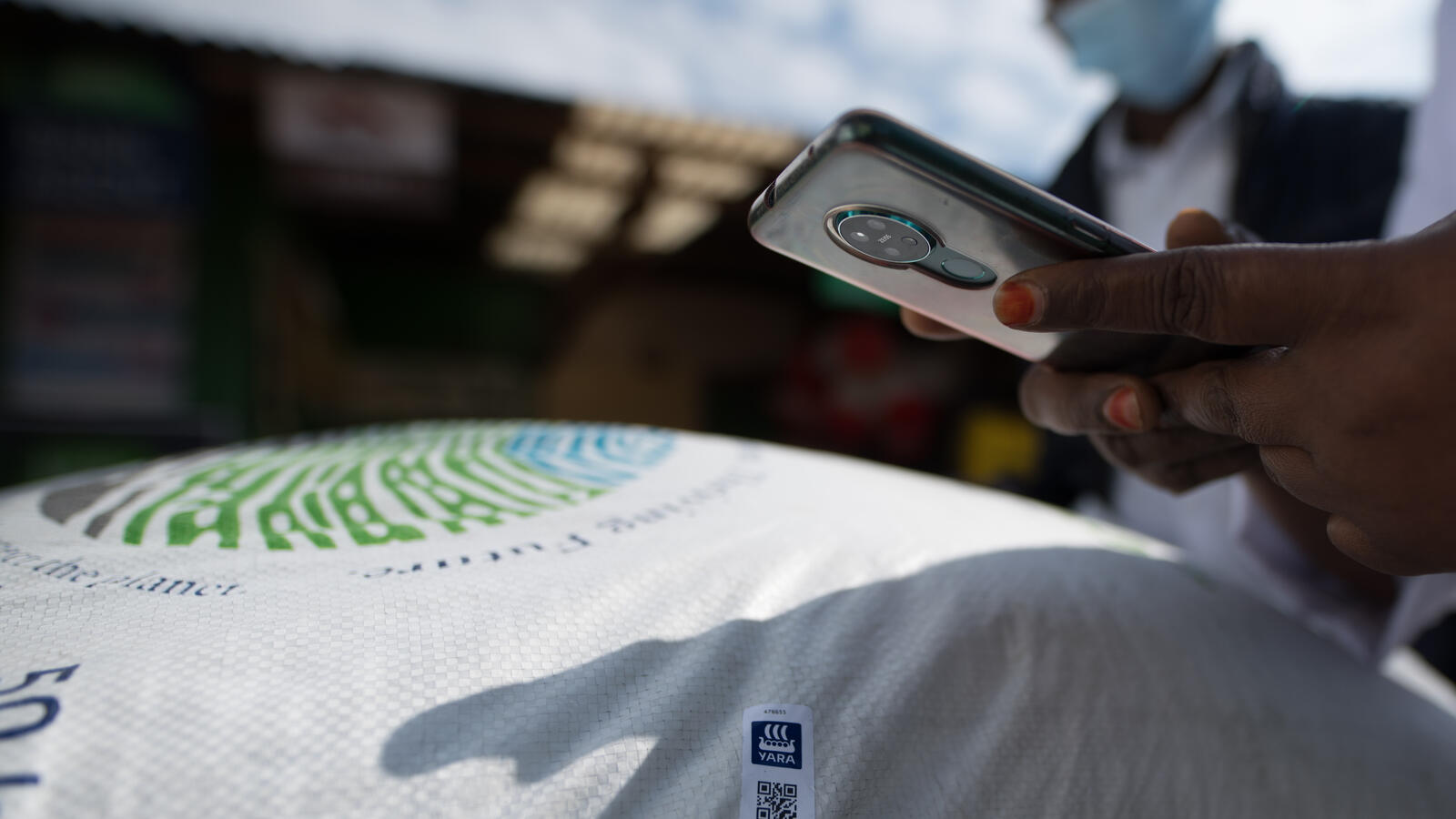 Woman scanning QR code with a mobile phone